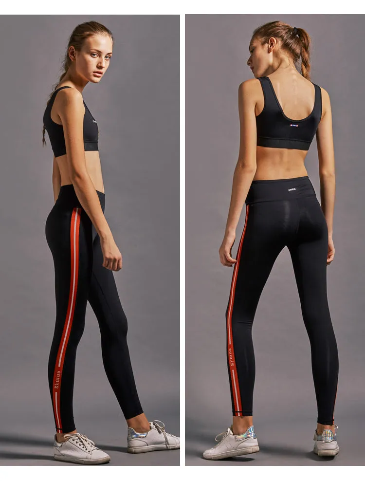 GYMNA RED SIDE STRIPE LEGGINGS IN BLACK