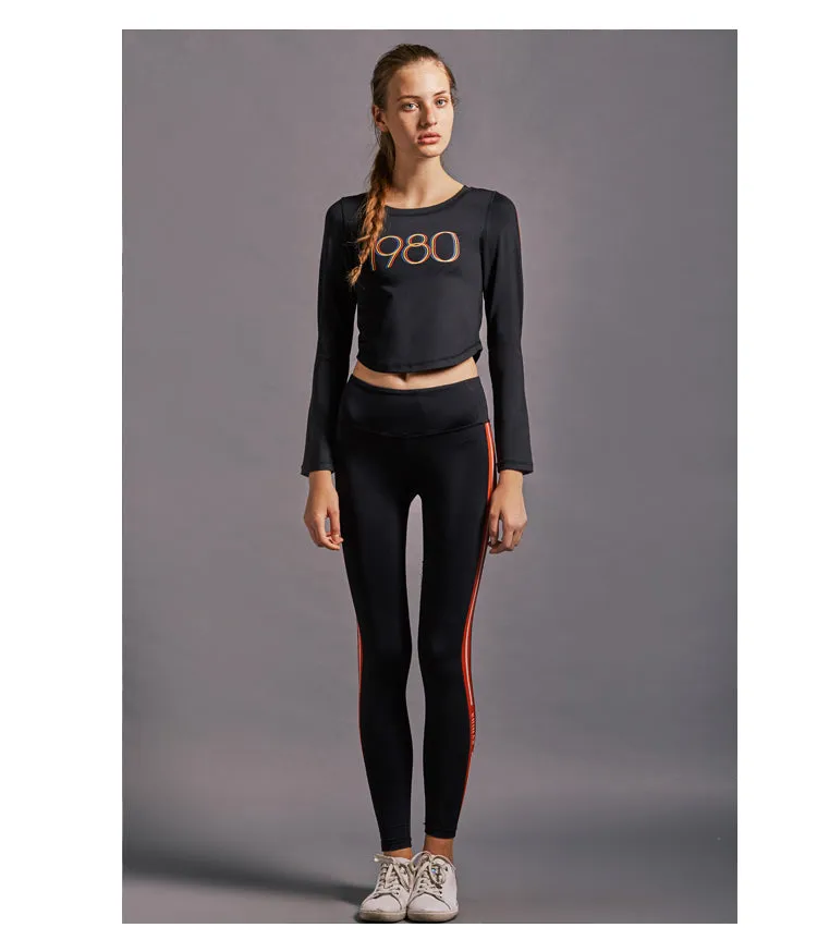 GYMNA RED SIDE STRIPE LEGGINGS IN BLACK