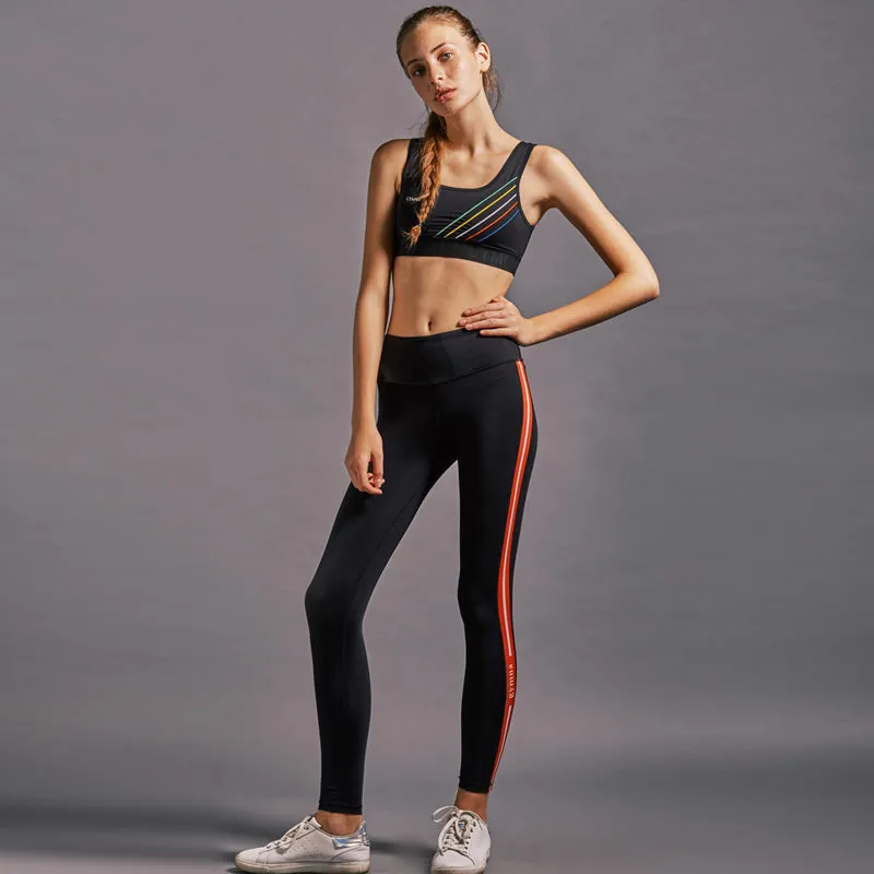 GYMNA RED SIDE STRIPE LEGGINGS IN BLACK