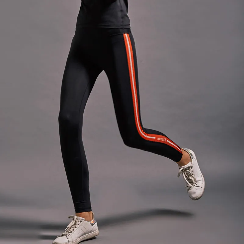 GYMNA RED SIDE STRIPE LEGGINGS IN BLACK